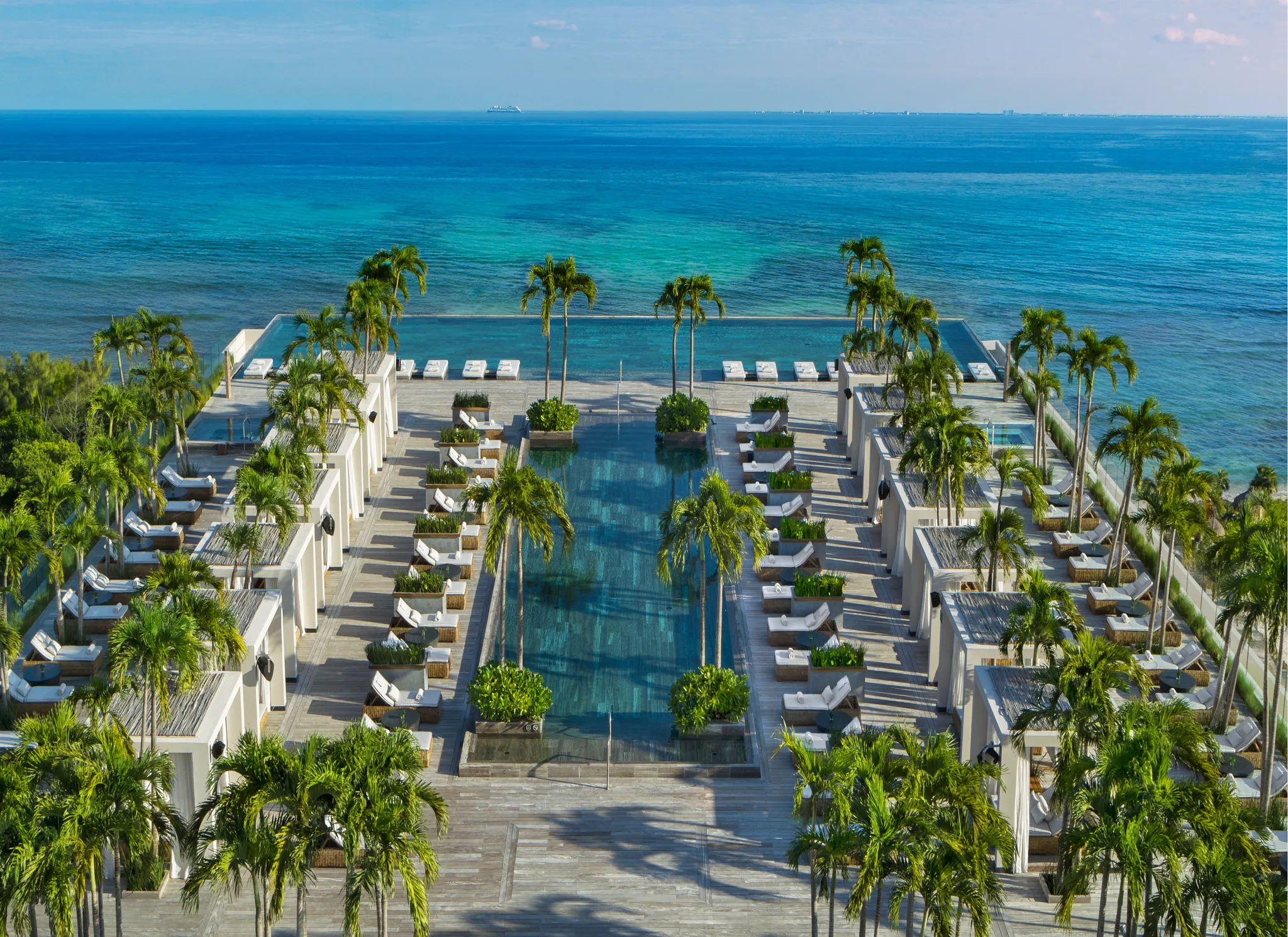 Aerial view of the rooftop infinity pool overlooking the Caribbean Sea at Impression Moxché by Secrets.