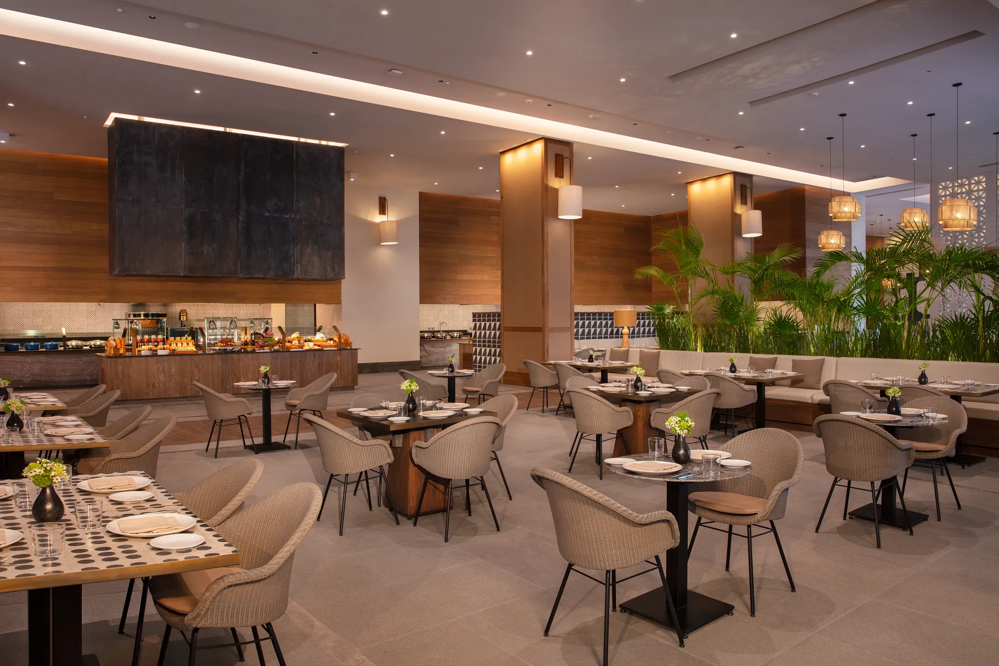 Market Café buffet restaurant at Impression Moxché by Secrets featuring spacious modern dining, international food stations, and contemporary décor.