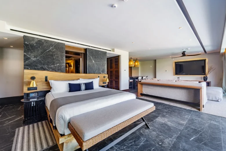 Master Suite Swimout Tropical View king bedroom with modern décor at Impression Moxché by Secrets.