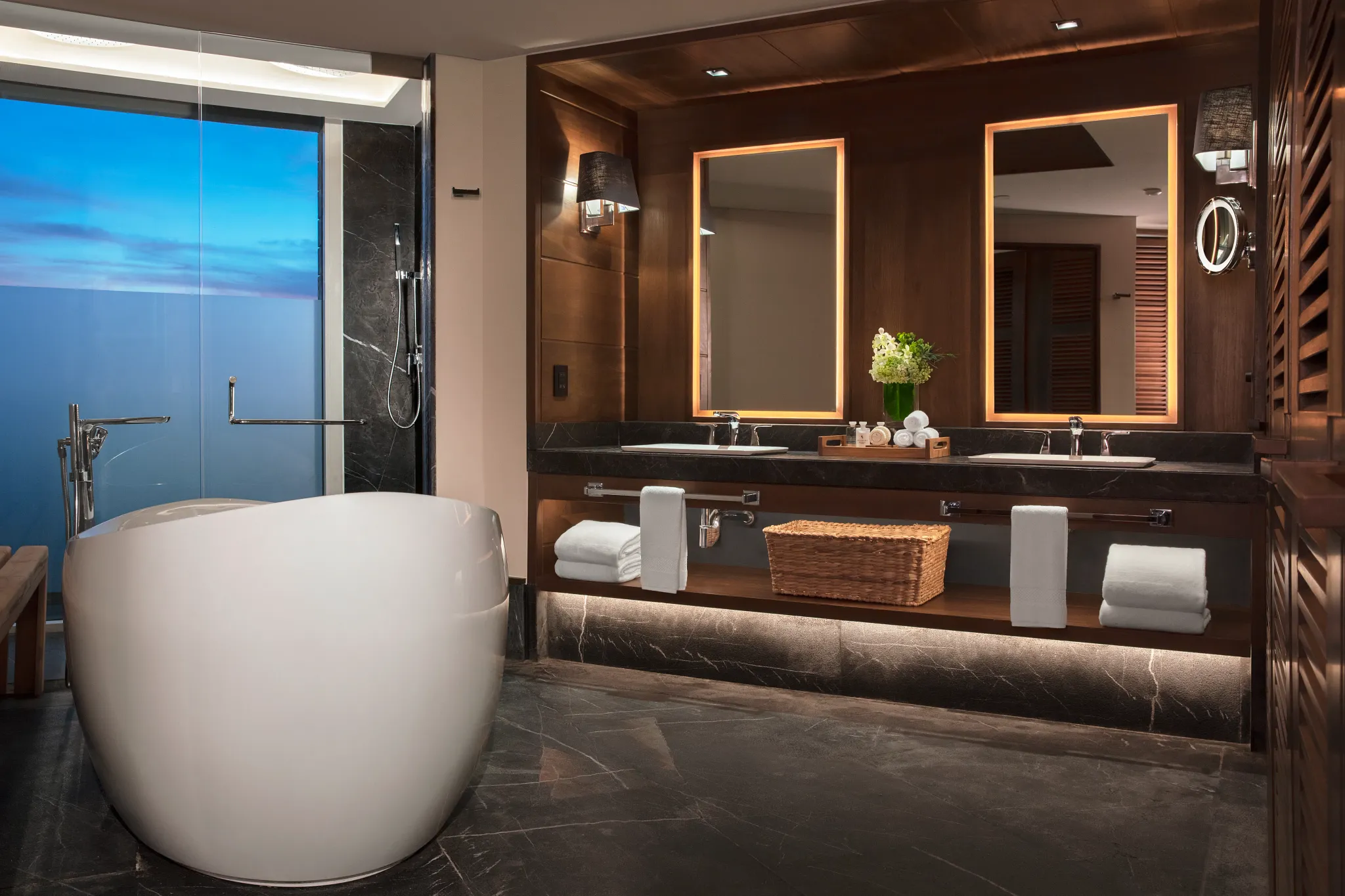 Panoramic Suite Ocean Front bathroom with freestanding tub and rain shower at Impression Moxché by Secrets.