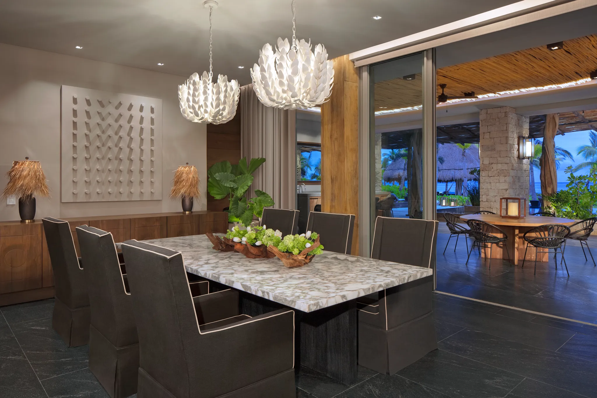 Presidential Villa Beach Front dining room with seating for eight at Impression Moxché by Secrets.