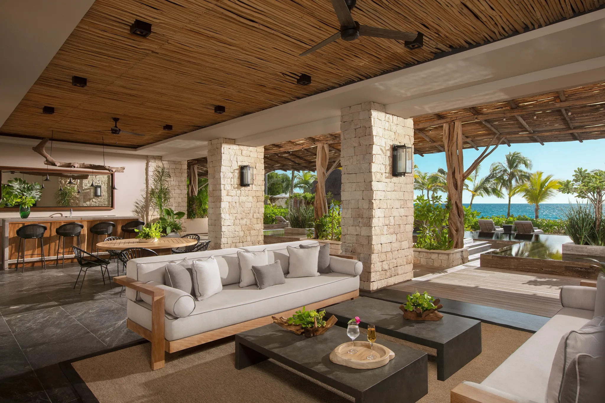 Presidential Villa Beach Front terrace lounge with pool and ocean views at Impression Moxché by Secrets.