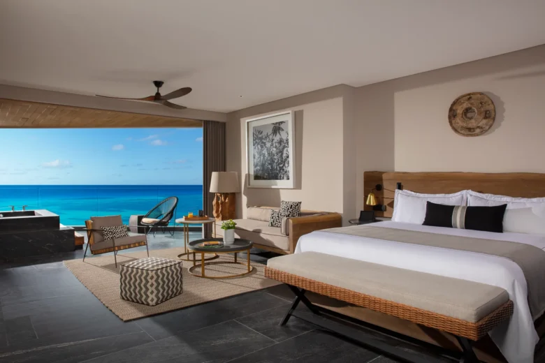 Signature Suite Ocean View with king bed and private terrace soaking tub overlooking the Caribbean at Impression Moxché by Secrets.