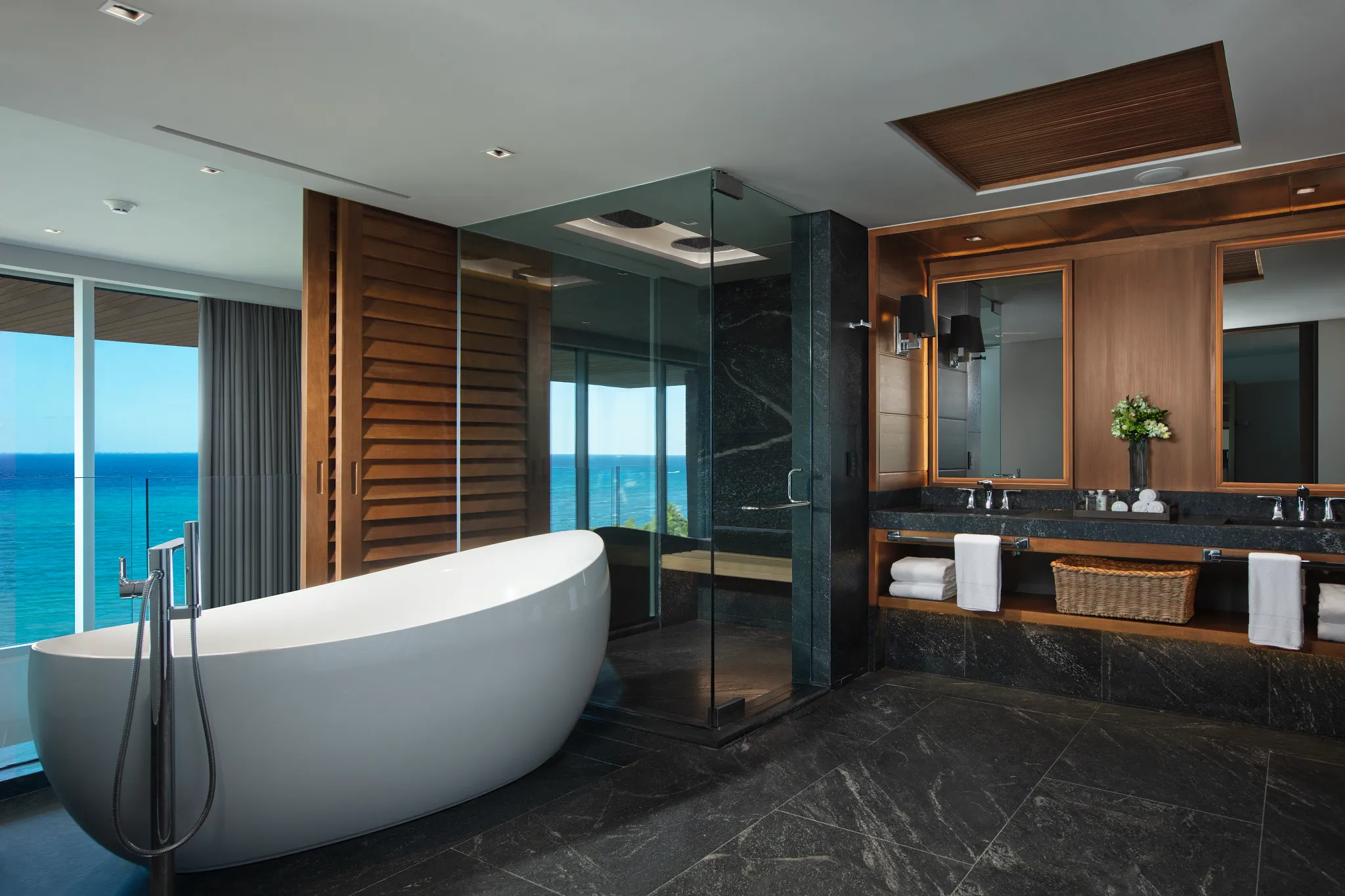 Two Story Penthouse Suite Ocean Front bathroom with soaking tub and rain shower at Impression Moxché by Secrets.