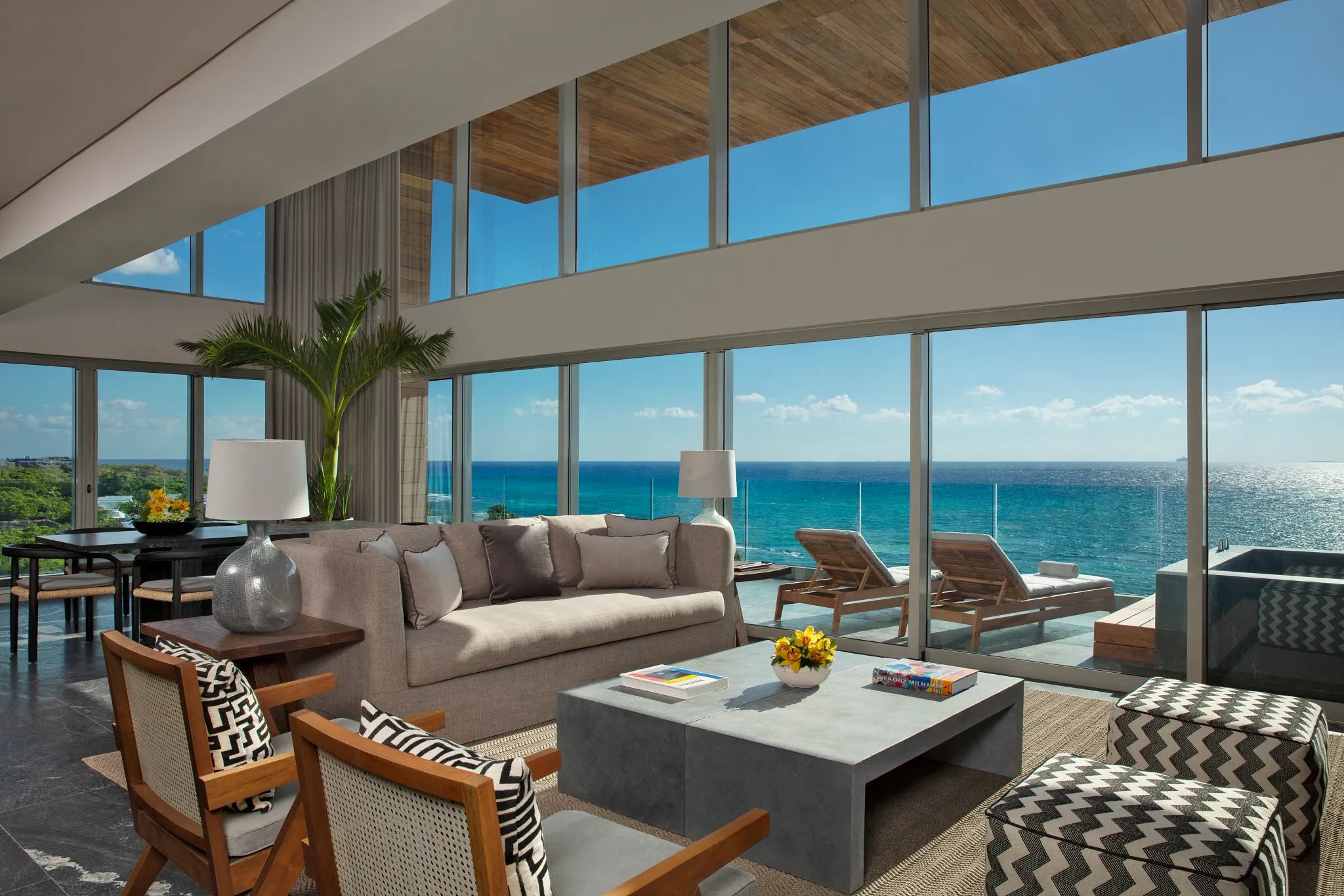 Two Story Penthouse Suite Ocean Front living room with panoramic ocean views at Impression Moxché by Secrets.